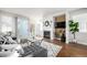 Stylish living room with sliding glass door, fireplace, and contemporary decor at 2550 Xanthia Ct, Denver, CO 80238