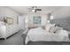 Comfortable bedroom featuring a tufted headboard bed, soft carpet, and modern decor for a relaxing space at 2550 Xanthia Ct, Denver, CO 80238