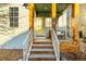 Charming porch with wood pillars and a cozy swing for relaxation at 2550 Xanthia Ct, Denver, CO 80238