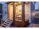 Relaxing front porch features a swing and sturdy wood columns at 2550 Xanthia Ct, Denver, CO 80238