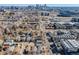 Urban aerial shot featuring city skyline, residential streets, and sports stadium at 2001 Grove St, Denver, CO 80211