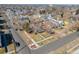 An aerial view of a neighborhood showcasing homes with fenced yards and mature trees at 2001 Grove St, Denver, CO 80211