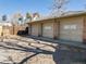 Three-car garage exterior with doors, offering ample parking and storage space at 2001 Grove St, Denver, CO 80211