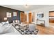 Stylish living room showcasing hardwood floors, modern decor, and a seamless flow into other living spaces at 2001 Grove St, Denver, CO 80211