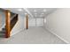 View of finished basement including painted walls, carpeted floor, and staircase with modern lighting at 15963 Rock Crystal Dr, Parker, CO 80134