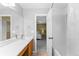 Clean bathroom with walk through to next bedroom, white countertop, and tub with shower at 15963 Rock Crystal Dr, Parker, CO 80134