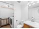 Convenient bath and laundry room combination with washer, dryer, vanity and mirror at 15963 Rock Crystal Dr, Parker, CO 80134