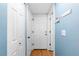 Clean, brightly lit entryway with a clean front door flanked by closets at 15963 Rock Crystal Dr, Parker, CO 80134