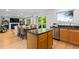 Modern kitchen featuring stainless steel appliances and granite countertops, with adjacent dining area at 15963 Rock Crystal Dr, Parker, CO 80134