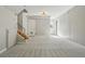Spacious basement featuring stair access to the upper floor and two access doors at 1905 S Linden Ct, Denver, CO 80224