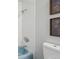 Bathroom featuring a toilet, wall decor, and tub/shower with white tile at 1905 S Linden Ct, Denver, CO 80224