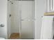 Bathroom showcasing glass enclosed shower with tile surround at 1905 S Linden Ct, Denver, CO 80224