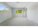Bright bedroom features two windows letting in natural light and mirrored closet doors at 1905 S Linden Ct, Denver, CO 80224
