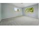 Bedroom featuring gray walls, two windows and gray carpeting at 1905 S Linden Ct, Denver, CO 80224