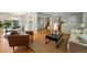 Open living room with hardwood floors and an expansive mirrored wall at 1905 S Linden Ct, Denver, CO 80224