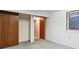 Unfinished basement room with closet, window and entry door at 2640 S Vaughn Way # D, Aurora, CO 80014