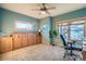 Bedroom area featuring plush carpets, ample natural lighting and a convertible murphy bed at 995 Nob Hill Rd, Evergreen, CO 80439