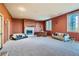 Spacious living room with a cozy fireplace and plenty of room for furniture at 995 Nob Hill Rd, Evergreen, CO 80439