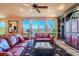 Comfortable living room with hardwood floors and scenic mountain views at 995 Nob Hill Rd, Evergreen, CO 80439