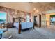 Cozy main bedroom featuring carpet floors, scenic views, a sauna, and neutral paint colors at 995 Nob Hill Rd, Evergreen, CO 80439