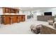 Spacious basement featuring a wet bar, entertainment area, and comfortable seating at 5340 S Logan Dr, Greenwood Village, CO 80121