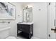 Modern bathroom features a black vanity, ample lighting, and a glass-enclosed shower at 5340 S Logan Dr, Greenwood Village, CO 80121