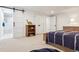 Charming bedroom with modern barn door to bath, and a large window that provides natural light at 5340 S Logan Dr, Greenwood Village, CO 80121