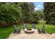 Inviting stone fire pit surrounded by Adirondack chairs, creating a perfect space for gathering and relaxation at 5340 S Logan Dr, Greenwood Village, CO 80121