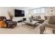 Cozy living room with a large sofa and chair that provides seating for a large Gathering at 5340 S Logan Dr, Greenwood Village, CO 80121