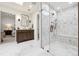 Spa-like bathroom featuring a vanity and frameless shower with skylight and views to the bedroom at 5340 S Logan Dr, Greenwood Village, CO 80121