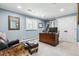 Comfortable home office with a wooden desk, bookshelves, and a leather chair at 5340 S Logan Dr, Greenwood Village, CO 80121