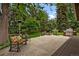 Cozy stone patio with comfortable seating and a built-in grill, perfect for outdoor entertaining at 5340 S Logan Dr, Greenwood Village, CO 80121