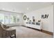 Well-lit playroom with bright white walls, comfortable chairs, and large windows at 5340 S Logan Dr, Greenwood Village, CO 80121