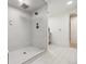 Modern tiled shower with dual shower heads and seamless glass door at 5340 S Logan Dr, Greenwood Village, CO 80121