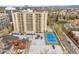 Full building aerial view of the property featuring the tennis court and parking lot at 800 N Pearl St # 709, Denver, CO 80203