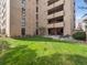 Lush backyard featuring a well-manicured lawn, patio seating, and mature landscaping at 800 N Pearl St # 709, Denver, CO 80203