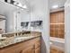 Bathroom featuring a vanity with granite countertop and a tiled shower/bathtub at 800 N Pearl St # 709, Denver, CO 80203