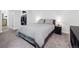 Well-lit bedroom featuring a walk-in closet, carpeted floors, and a comfortable queen size bed at 800 N Pearl St # 709, Denver, CO 80203