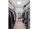 Walk-in closet with ample shelving and hanging space, featuring neatly organized clothing and accessories at 800 N Pearl St # 709, Denver, CO 80203
