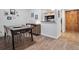Inviting dining area with stylish furnishings, wood floors, and an open view to the adjacent kitchen at 800 N Pearl St # 709, Denver, CO 80203