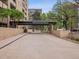 Property entrance featuring porte cochere, mature landscaping, and a welcoming drive at 800 N Pearl St # 709, Denver, CO 80203
