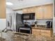 Well-equipped kitchen with stainless steel appliances, granite counters, and light wood cabinetry at 800 N Pearl St # 709, Denver, CO 80203