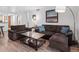 Comfortable living room featuring a sectional sofa, a wooden coffee table, and modern decor at 800 N Pearl St # 709, Denver, CO 80203