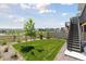 Landscaped backyard featuring a well-maintained lawn and fence at 13334 Blue Amber Ct, Parker, CO 80134