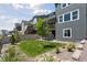 Spacious backyard with a lawn, fence, and convenient access to the upper deck at 13334 Blue Amber Ct, Parker, CO 80134