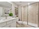 Modern bathroom with a glass-enclosed shower, vanity with quartz countertop, and stylish accents at 13334 Blue Amber Ct, Parker, CO 80134