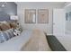 Stylish bedroom with aviation themed decor, featuring a cozy bed, bench, and modern lighting at 13334 Blue Amber Ct, Parker, CO 80134
