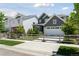 Charming neighborhood street featuring a gray two-story home with a well-kept lawn at 13334 Blue Amber Ct, Parker, CO 80134