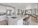 Spacious kitchen with large island, stainless appliances, breakfast bar, and open floor plan at 13334 Blue Amber Ct, Parker, CO 80134
