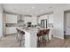 Bright kitchen with a large island, modern appliances, and sleek cabinetry at 13334 Blue Amber Ct, Parker, CO 80134